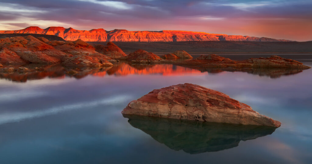 sand hollow reservoir at sunset with reflection in water